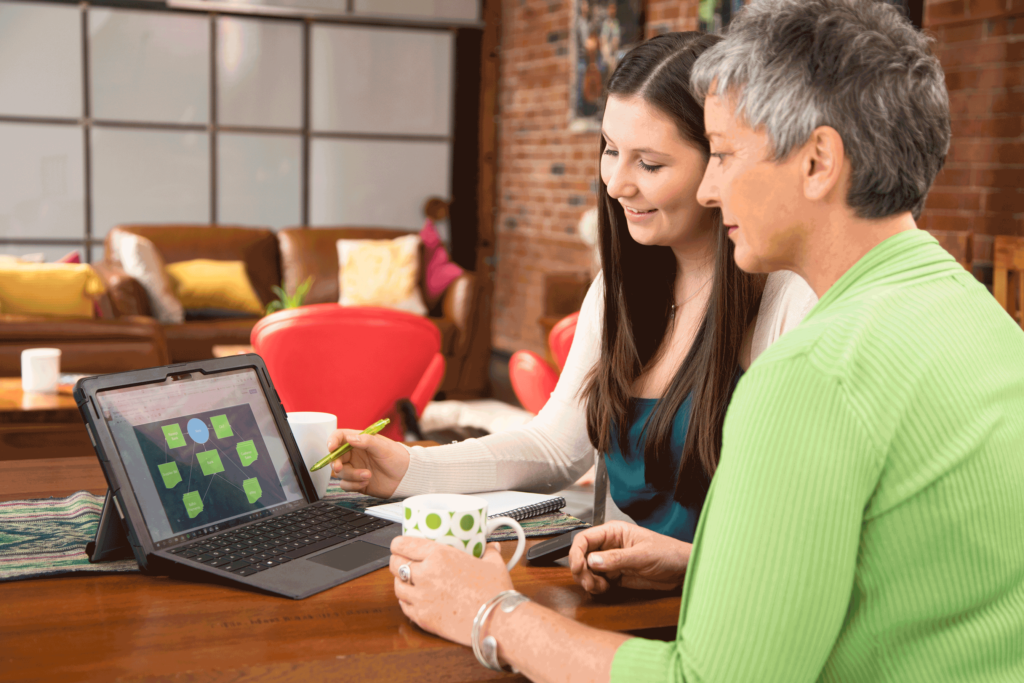 Business Advisor Looking at screen with client